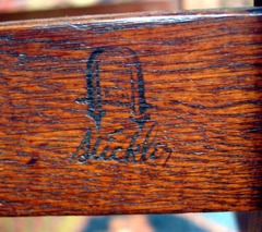 Signature on arm chair.